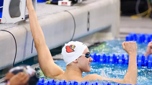 Nicolas Albiero celebrates after winning the 100 butterfly consolation final at the NCAA Championships.