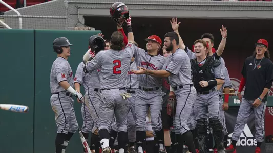 The Cardinals celebrate Tyler Fitzgerald's home run at NC State.