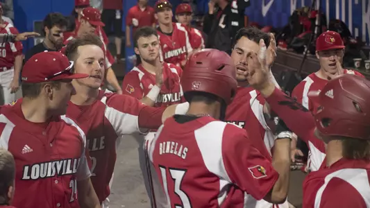 Alex Binelas greeted by his teammates at Kentucky.