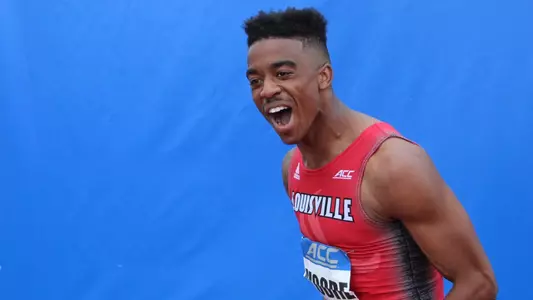 Martice Moore celebrates after winning the 110m hurdles