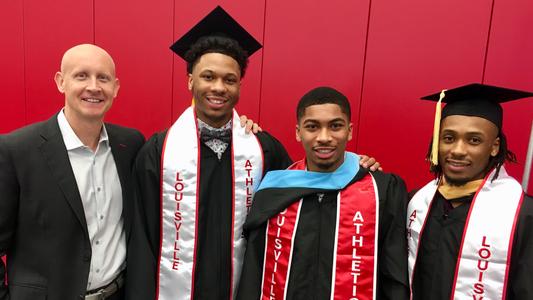 UofL men's basketball coach Chris Mack poses with 2019 UofL graduates Dwayne Sutton, Christen Cunningham and Khwan Fore.