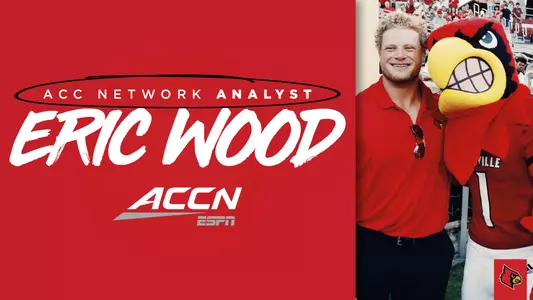 Eric Wood poses with the Cardinal Bird