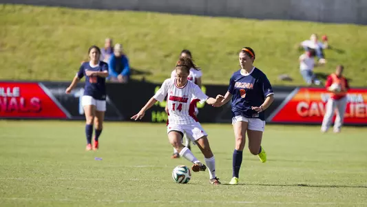 Chiney Asher dribbles the ball against Virginia