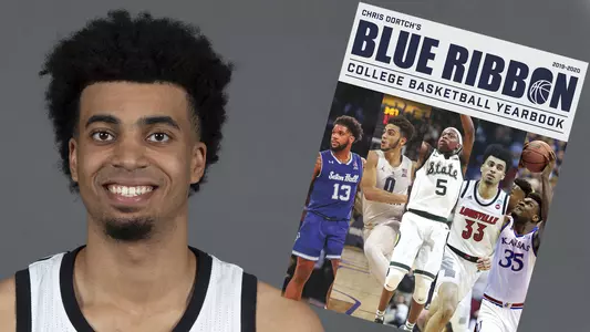 Jordan Nwora appears on the cover of the 2019-20 Blue Ribbon Yearbook cover.