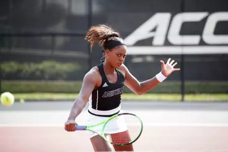 Raven Neely hits a backhand