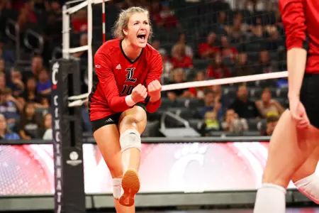 Melanie McHenry celebrates a Cardinals point during the fourth set at Cincinnati.