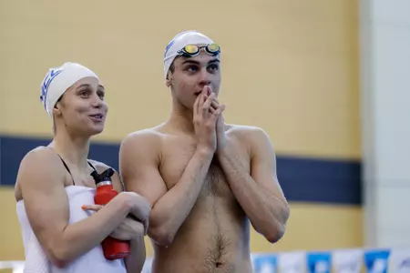 Nick Albiero and Mallory Comerford check the scoreboard on deck