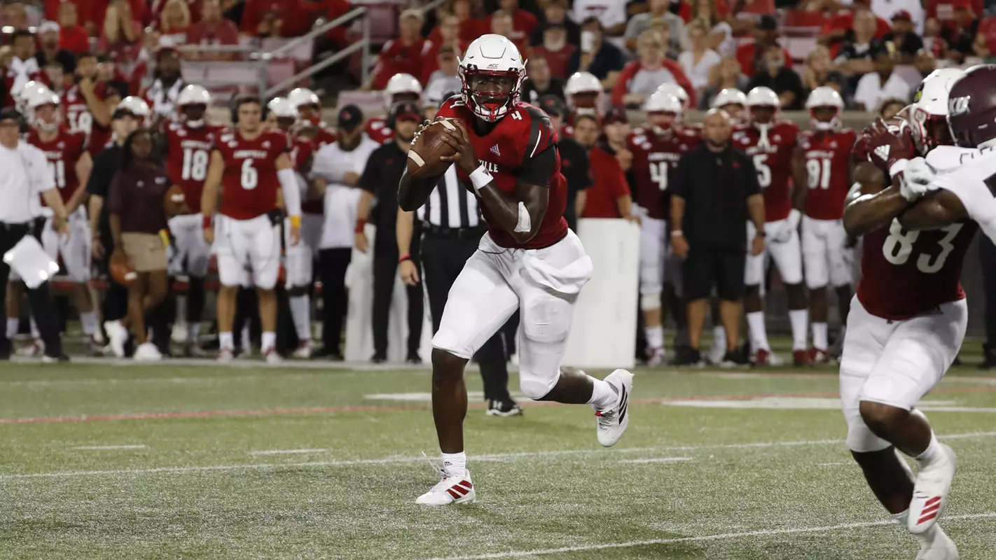 Jawon Pass rolls out for a pass against Eastern Kentucky at Cardinal Stadium.