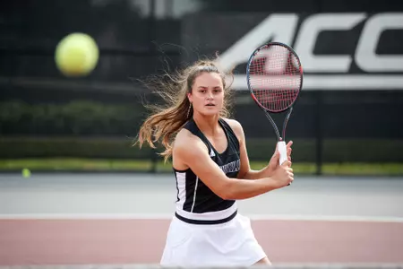 Dina Chaika hits a backhand