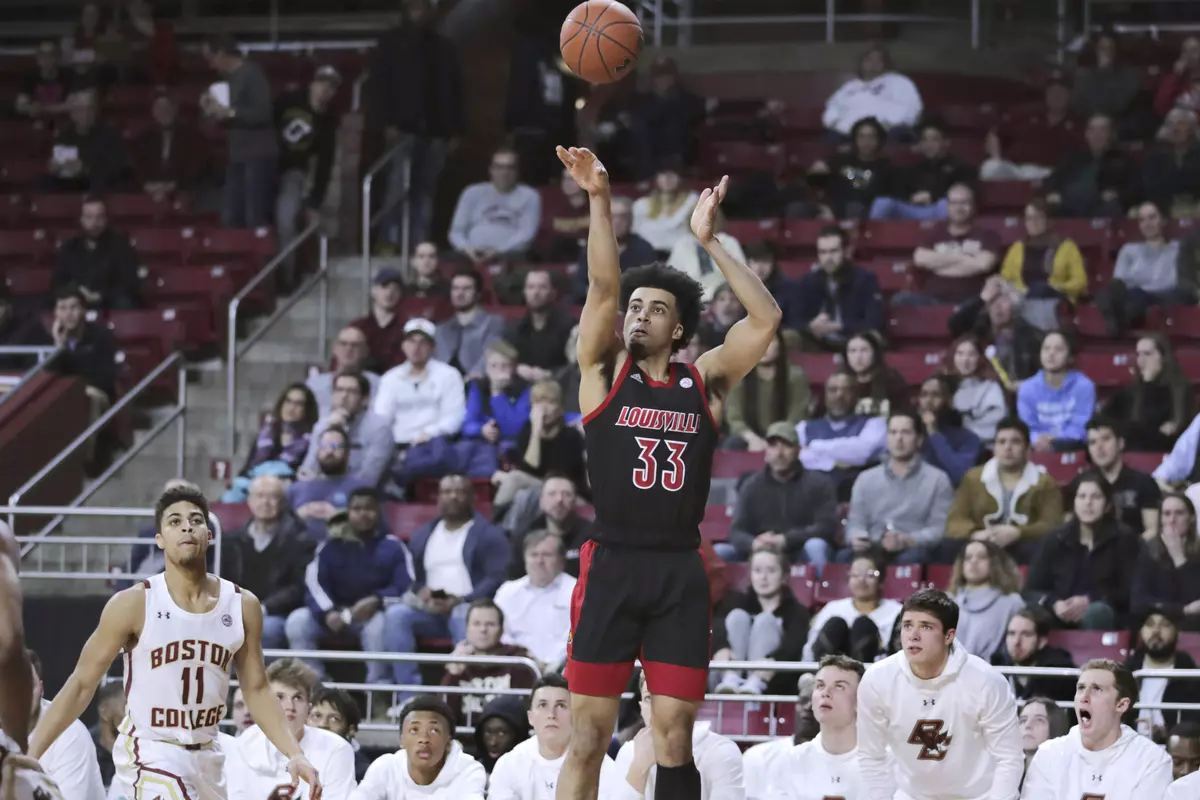 Louisville forward Jordan Nwora (33) shoots as Boston College players watch during the first half of an NCAA college basketball game in Boston, Wednesday, Jan. 29, 2020. (AP Photo/Charles Krupa)