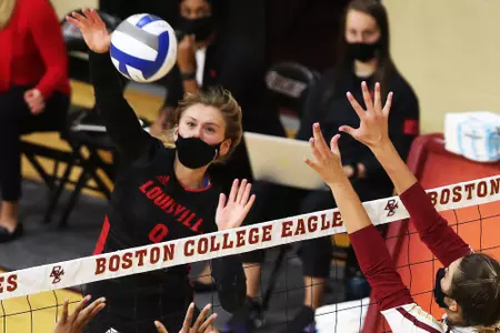 Claire Chaussee swings at the net against BC