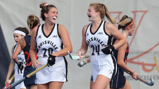 Katie Schneider and Madison Walsh celebrate after scoring a goal at Virginia