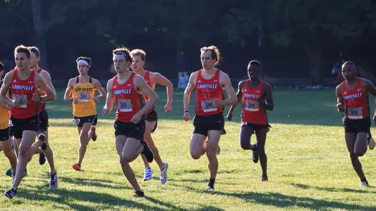 Men's cross country team running in the Live in Lou Classic