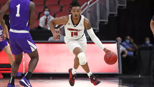 Dre Davis drives vs. Evansville in UofL's 2020-21 season opener the KFC Yum! Center