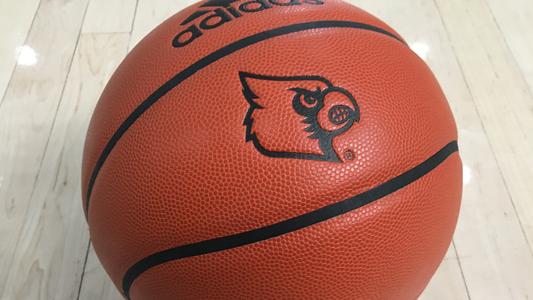 Tight photo of a basketball with the Cardinal logo