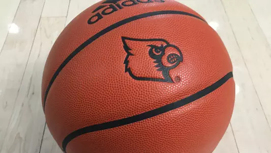 Tight photo of a basketball with the Cardinal logo