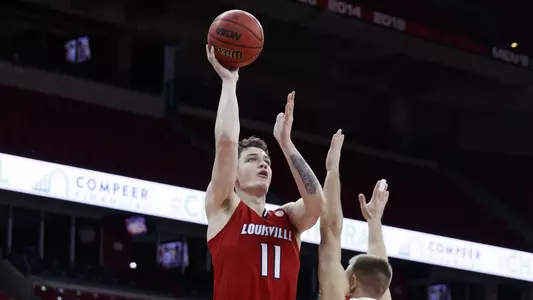 Quinn Slazinski rises to shoot against Wisconsin on Dec. 19, 2020