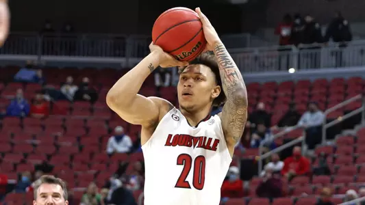 Josh Nickelberry shoots against Kentucky in the KFC Yum! Center on Dec. 26
