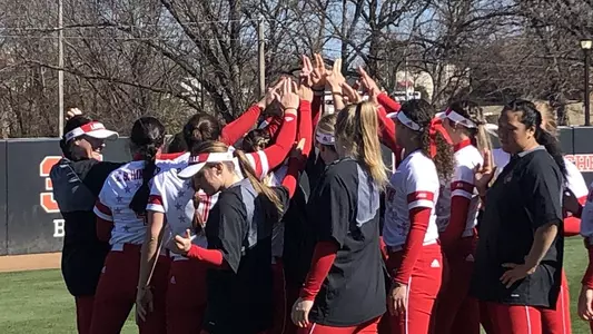 Softball huddle before the UIC game