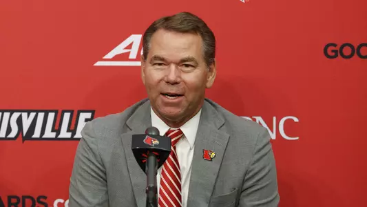 Vince Tyra speaks to media at a news conference last year.