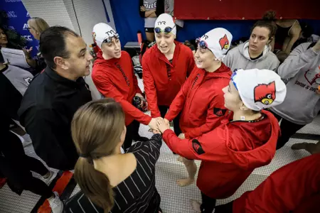 Arthur Albiero congratulates the relay team