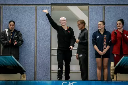 Molly Fears waves to the fans from the platform