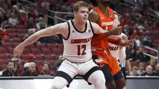 Hogan Orbaugh fights for position in the lane against Syracuse.