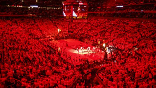 The KFC Yum! Center is lit red for introductions prior to the Cardinals' game vs. Michigan in 2019