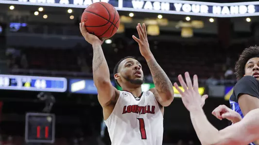 Carlik Jones rises to shoot against Duke in the KFC Yum! Center on Jan. 23.