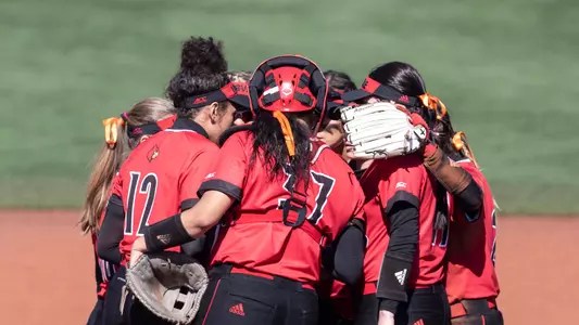 Louisville Cardinals Softball huddle during the game vs Northwestern at Ulmer stadium on March 7, 2020.