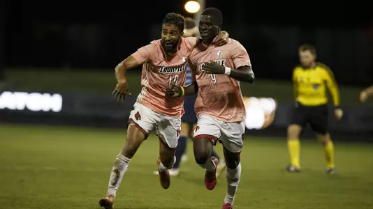 Pedro Fonseca and Aboubacar Camara celebrate a goal against North Carolina.