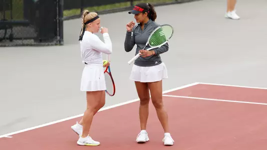 Andrea Di Palma, Rhea Verma confer at center court