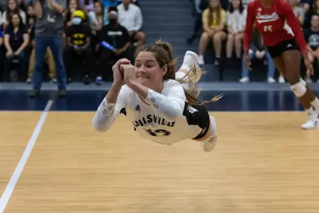 Elena Scott dives for a dig versus GT