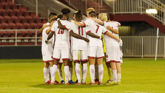 The Cardinals huddle against Western Illinois.