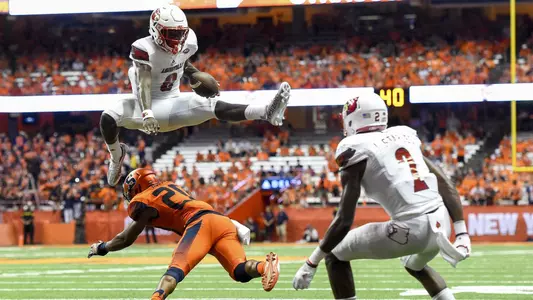 FB: Lamar Jackson leaps over a Syracuse defender