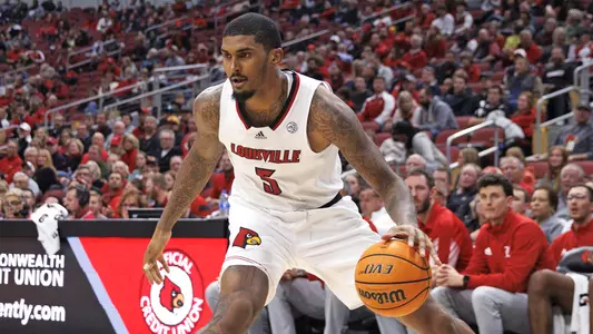 Malik Williams drives against Navy in the KFC Yum! Center on Nov. 15, 2021.