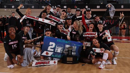 The 2021 Volleyball Team Celebrates with the ACC trophy 