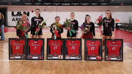 Louisville's six seniors pose with their bouquets