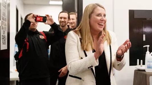 Dani Busboom Kelly celebrates in the lockerroom