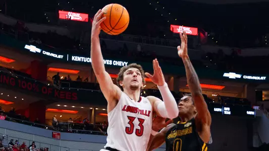 Matt Cross drives to the hoop against Southeastern Louisiana in the KFC Yum! Center on Dec. 14.