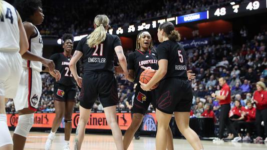 Louisville women's basketball celebrates during its win over UConn.