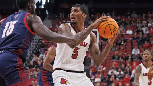 Malik Williams looks to pass against Detroit Mercy in the KFC Yum! Center on Nov. 20.