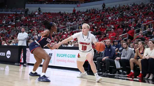 Hailey Van Lith drives past Belmont defender