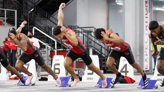 Louisville track and field athletes on the starting blocks