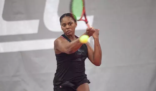 Raven Neely returns a serve