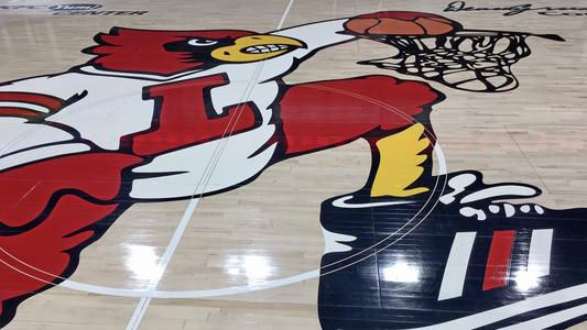 Dunking bird logo at mid-court at the KFC Yum! Center