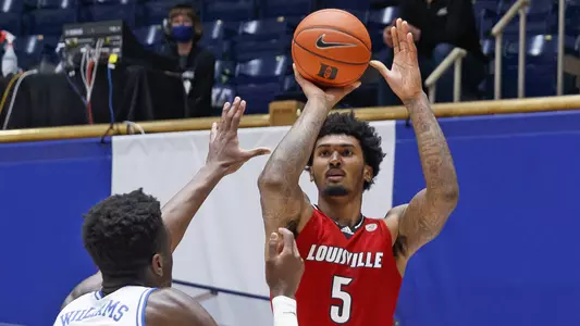 Malik Williams shoots against Duke on Feb. 27