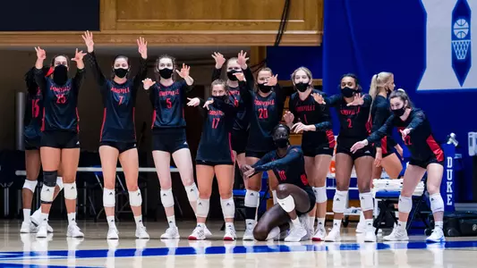 Louisville sideline cheering at Duke