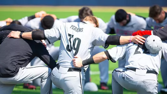 The Cardinals huddle before the game at Notre Dame.
