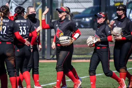 Softball high fives during lineups
